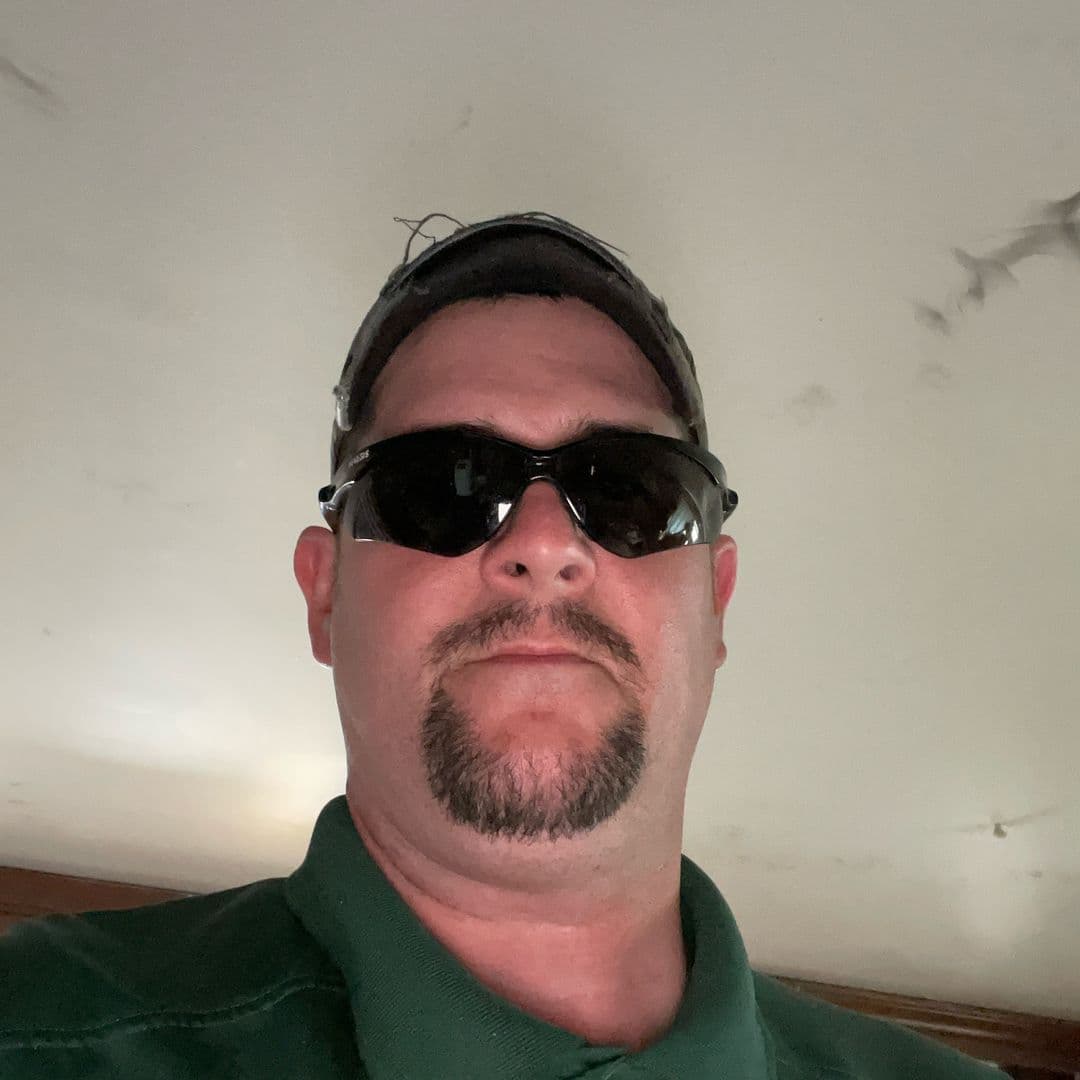 Mark wearing a cap and sunglasses