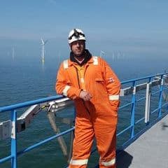 Peter in offshore high-vis gear on a wind-farm platform